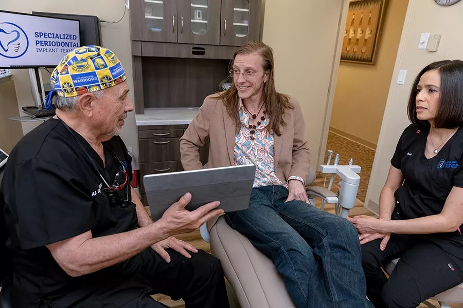 happy patient talking to the dentist